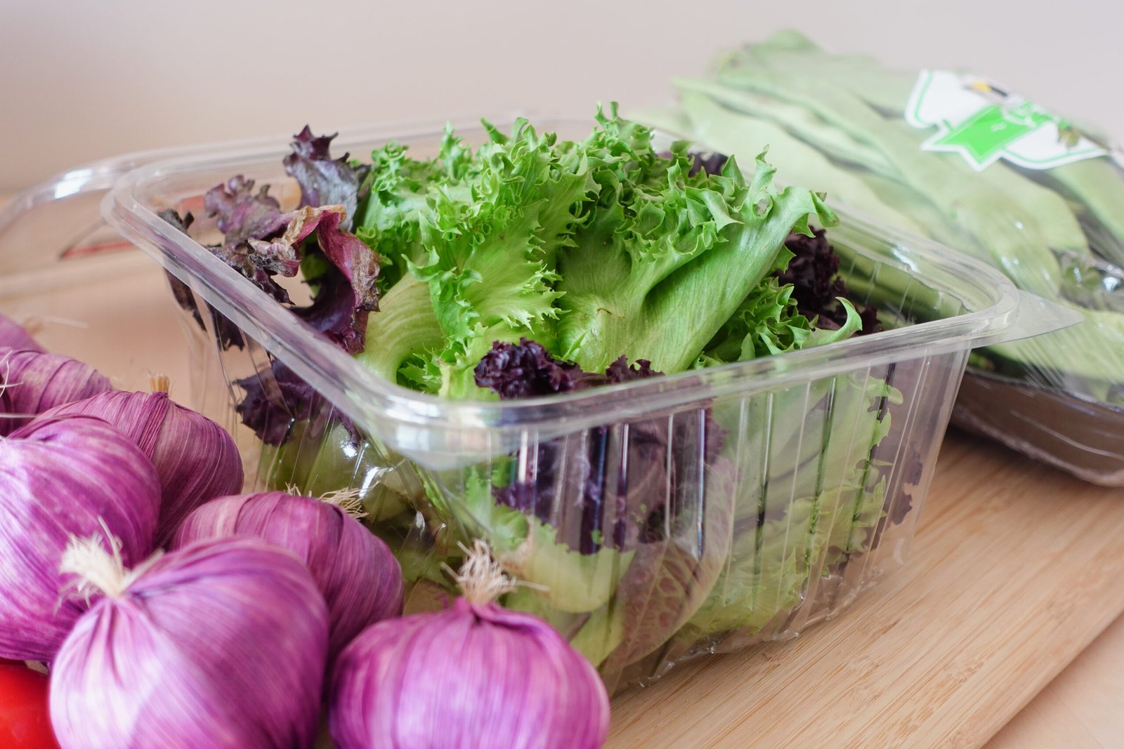 A vibrant assortment of colorful salad ingredients that includes crisp lettuce and fresh onions